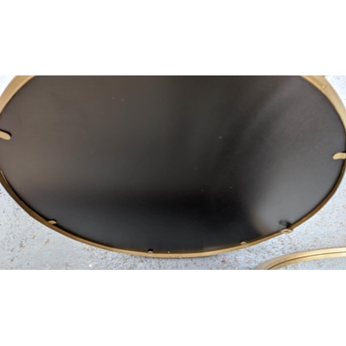 410 - CIRCULAR WALL MIRRORS, a pair, gilt metal frames, 60cm diam. (2)