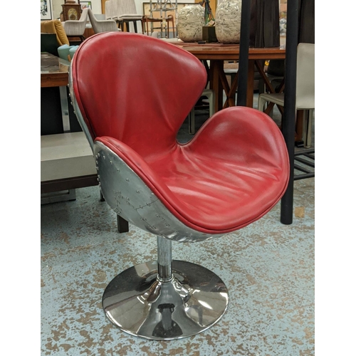 486 - SWAN STYLE SWIVEL CHAIR, Aviator style with distressed red leather upholstery, 68cm W x 91cm H.