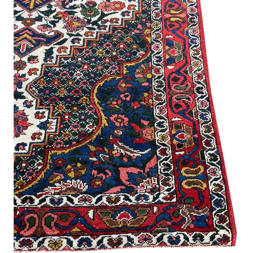 90 - ANTIQUE BAKTIARI RUG, 210cm x 137cm.