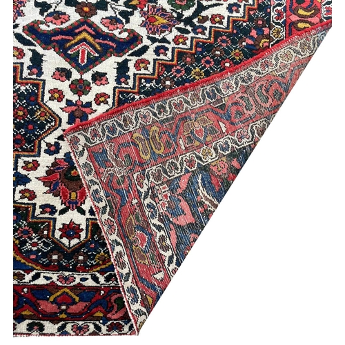 90 - ANTIQUE BAKTIARI RUG, 210cm x 137cm.