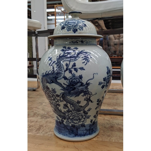 316 - TEMPLE JARS, a pair, Chinese export style, blue and white ceramic, dragon decoration, 39cm H. (2)