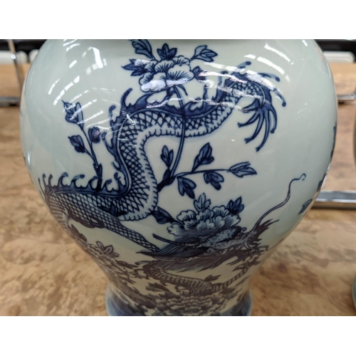 316 - TEMPLE JARS, a pair, Chinese export style, blue and white ceramic, dragon decoration, 39cm H. (2)