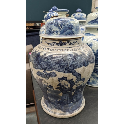 317 - TEMPLE JARS, a set of two Chinese export style, blue and white ceramic differing decoration and a va... 