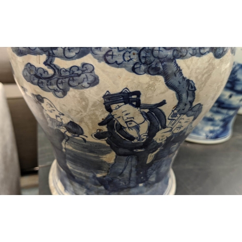 317 - TEMPLE JARS, a set of two Chinese export style, blue and white ceramic differing decoration and a va... 