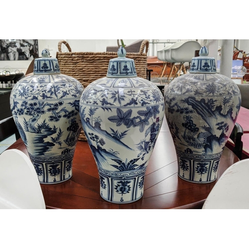 322 - PLUM VASES WITH COVERS, a set of three Chinese export style, blue and white, 48cm H. (3)