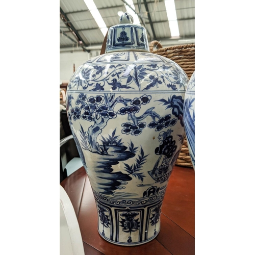 322 - PLUM VASES WITH COVERS, a set of three Chinese export style, blue and white, 48cm H. (3)