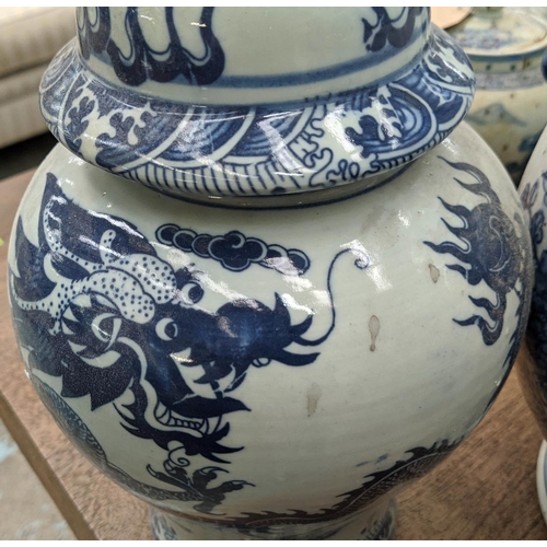 325 - VESSELS WITH COVERS, a set of four, various, Chinese export style, blue and white ceramic, 39cm H at... 