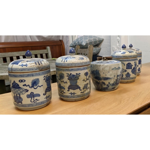 326 - JARS WITH COVERS, a set of four, Chinese export style, blue and white ceramic, and one other, 18cm a... 