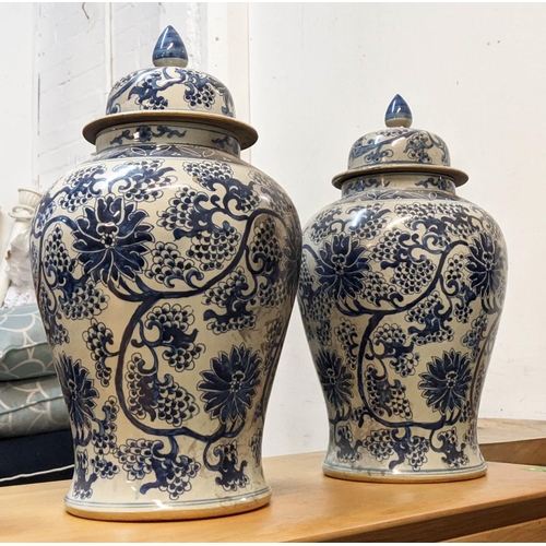 328 - TEMPLES JARS, a pair, Chinese export style, blue and white ceramic, chrysanthemum decoration, 49cm H... 