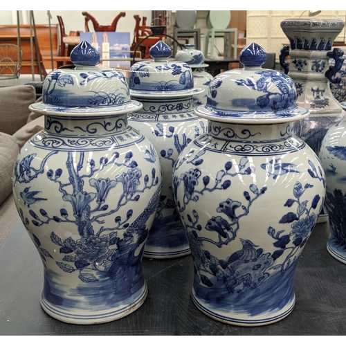 330 - TEMPLE JARS, a set of three, Chinese export style, blue and white ceramic, cherry blossom decoration... 