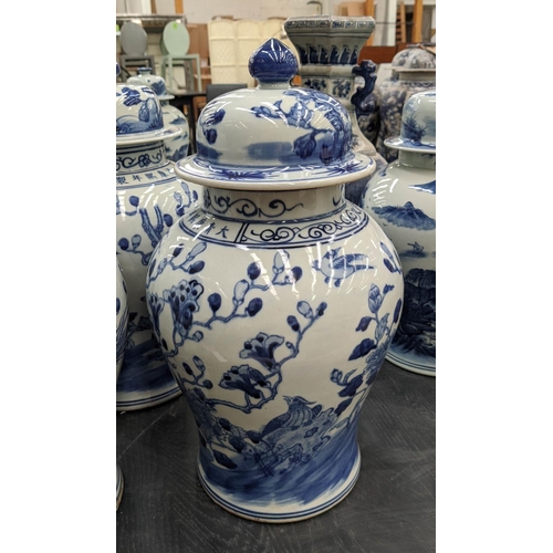 330 - TEMPLE JARS, a set of three, Chinese export style, blue and white ceramic, cherry blossom decoration... 