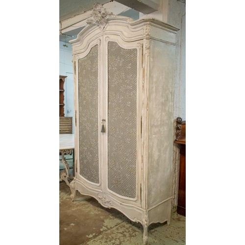 175 - ARMOIRE, late 19th century French painted, with two brass grille and silk lined doors enclosing hang... 