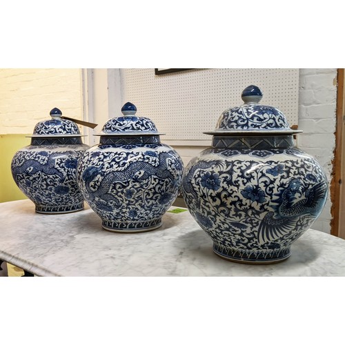 323 - JARS WITH COVERS, a set of three, Chinese export style, blue and white ceramic, 37cm H. (3)