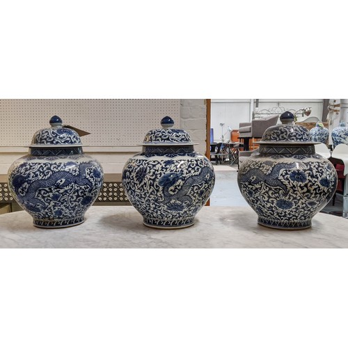 323 - JARS WITH COVERS, a set of three, Chinese export style, blue and white ceramic, 37cm H. (3)