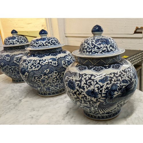 323 - JARS WITH COVERS, a set of three, Chinese export style, blue and white ceramic, 37cm H. (3)