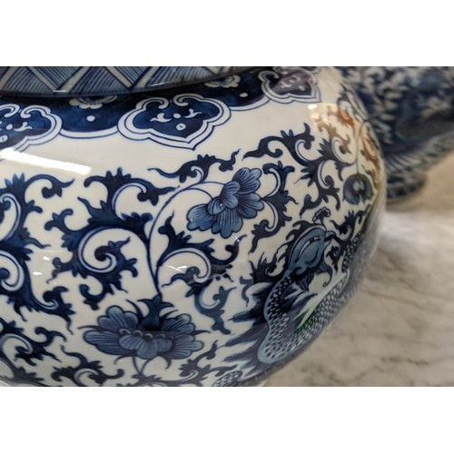 323 - JARS WITH COVERS, a set of three, Chinese export style, blue and white ceramic, 37cm H. (3)