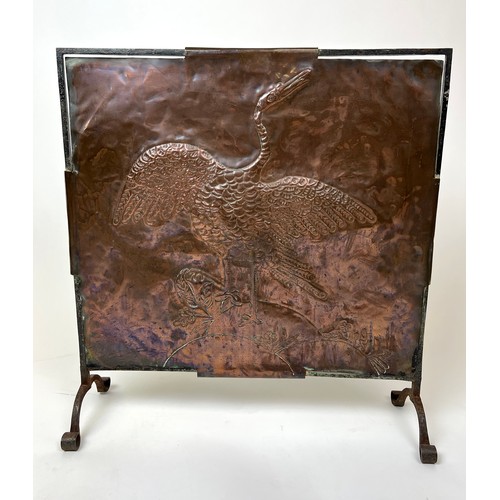 297 - ARTS AND CRAFTS FIRESCREEN, early 20th century hand beaten copper decorated with a crane with iron f... 