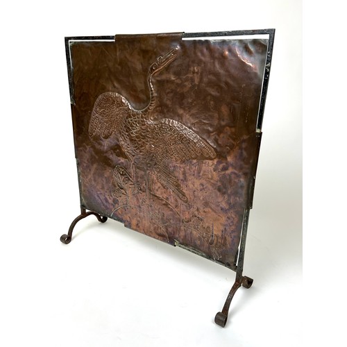 297 - ARTS AND CRAFTS FIRESCREEN, early 20th century hand beaten copper decorated with a crane with iron f... 