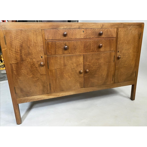 504 - HEALS SIDEBOARD, 1950s figured walnut, with drawers and cupboards flanked by further cupboards, labe... 