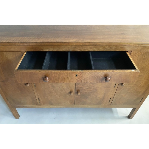 504 - HEALS SIDEBOARD, 1950s figured walnut, with drawers and cupboards flanked by further cupboards, labe... 