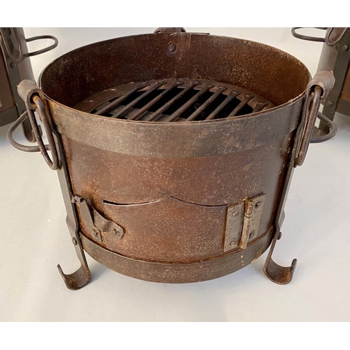 510 - SMALL FIRE PITS, each of two handled form, raised on three feet, 22cm x 36cm x 25cm. (3)