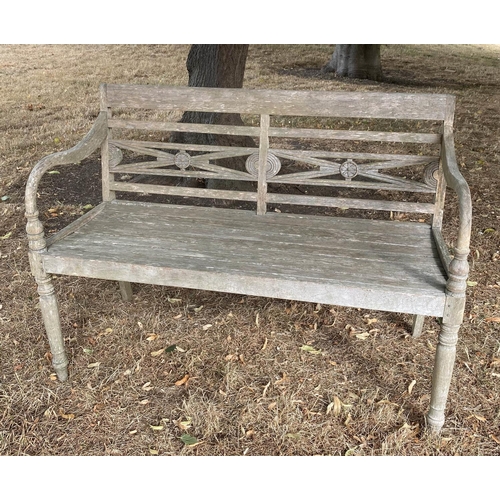 287 - COLONIAL STYLE GARDEN BENCH, weathered teak with carved back, slatted seat and downswept arms, 115cm... 