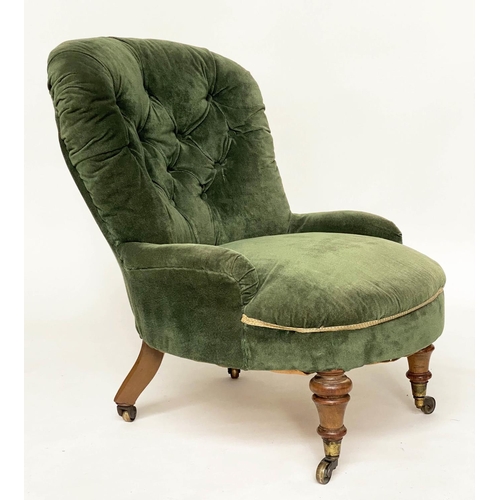 130 - SLIPPER ARMCHAIR, Victorian walnut with buttoned Royal green velvet upholstery and turned front supp... 