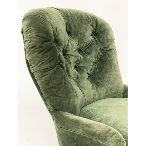 130 - SLIPPER ARMCHAIR, Victorian walnut with buttoned Royal green velvet upholstery and turned front supp... 