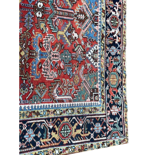 90 - ANTIQUE PERSIAN HERIZ CARPET, 295cm x 218cm.