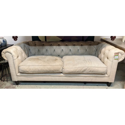 410 - CHESTERFIELD STYLE SOFA, 220cm W, with two floral scatter cushions.