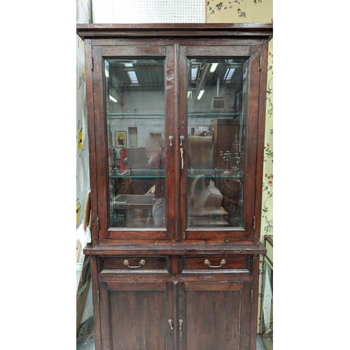 334 - GLAZED BOOKCASE, 103cm W x 45cm D x 204cm H, with glass section on a cupboard base.