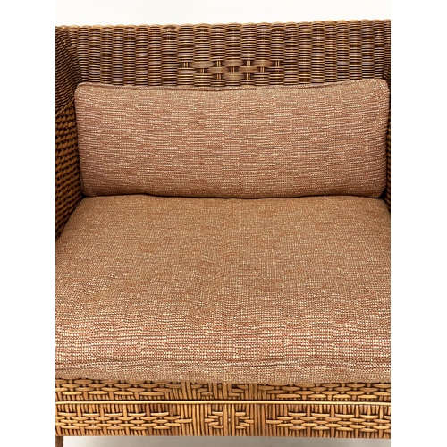 102 - RATTAN ARMCHAIR, 1970s rattan framed and decoratively woven cane panelled, with cushions, 71cm W.