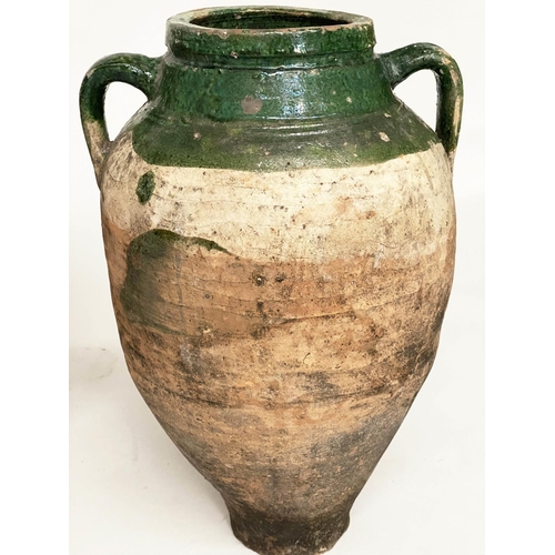 103 - OLIVE JARS, two Mediterranean terracotta of typical form, one with green glaze, 65cm H x 53cm H. (2)