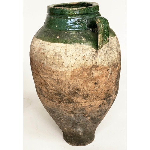 103 - OLIVE JARS, two Mediterranean terracotta of typical form, one with green glaze, 65cm H x 53cm H. (2)