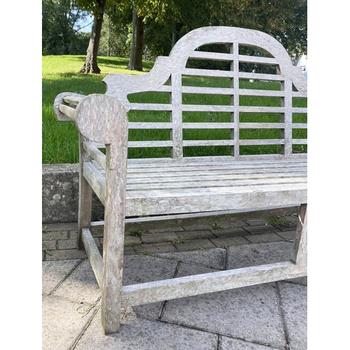 104 - LUTYENS STYLE BENCH, well weathered teak and slatted after a design by Sir Edwin Lutyens, 166cm W.