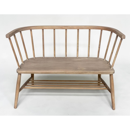 106 - HALL SEAT, English 1970s beech and elm in the manner of Ercol with enclosed rail back and shaped sea... 