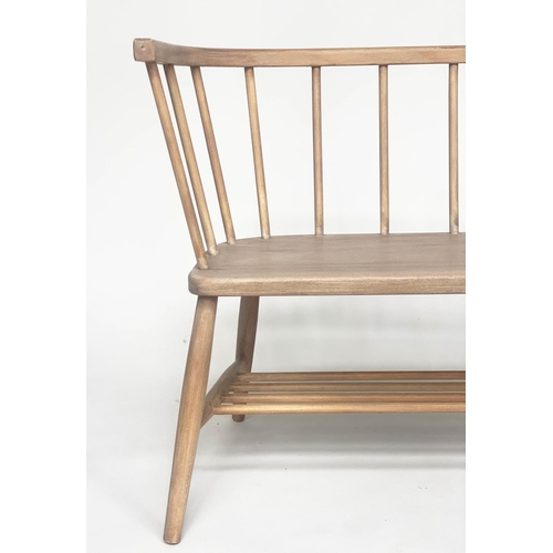 106 - HALL SEAT, English 1970s beech and elm in the manner of Ercol with enclosed rail back and shaped sea... 