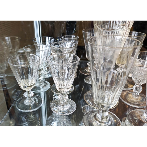 11 - COLLECTION OF ASSORTED DRINKING GLASSES, early 18th/mid 19th century including a set of tavern ramme... 