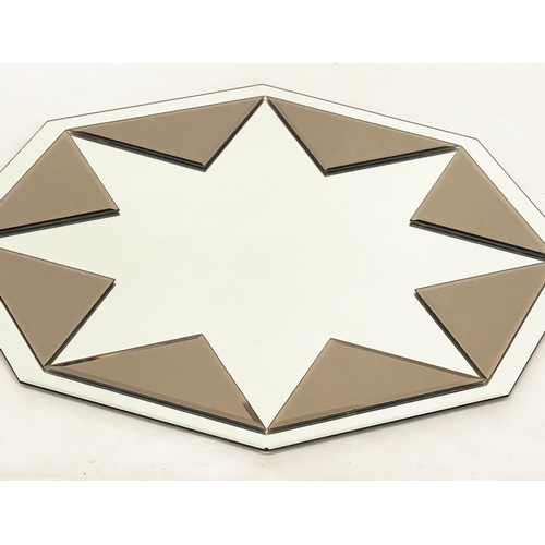 129 - WALL MIRROR, octagonal bevelled with sepia applied plates, 100cm W.