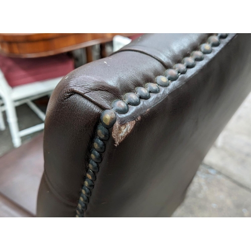 340 - DESK CHAIR, brown leather, deep buttoned back, swivel action, mahogany finish, 100cm H x 56cm W x 65... 