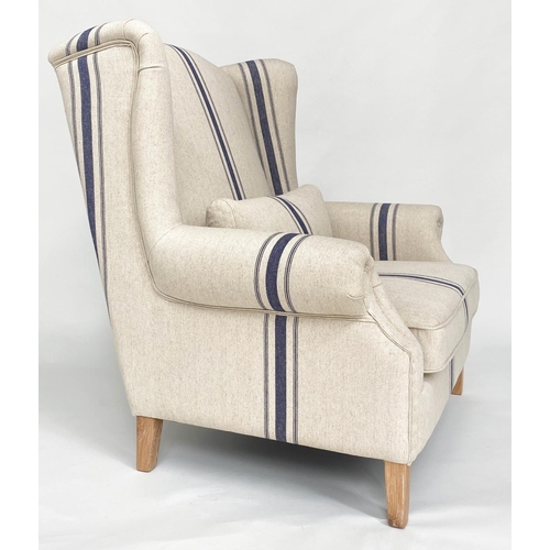 99 - WING ARMCHAIR BY COX AND COX, striped linen upholstered wide seat with tapering square oak supports,... 