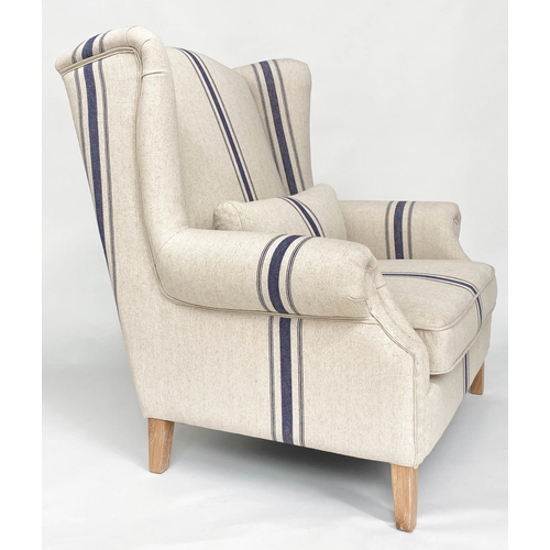 99 - WING ARMCHAIR BY COX AND COX, striped linen upholstered wide seat with tapering square oak supports,... 