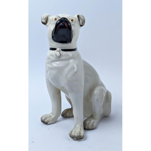 18 - STAFFORDSHIRE PUG DOGS, an opposing pair, late 19th century, 27cm H.