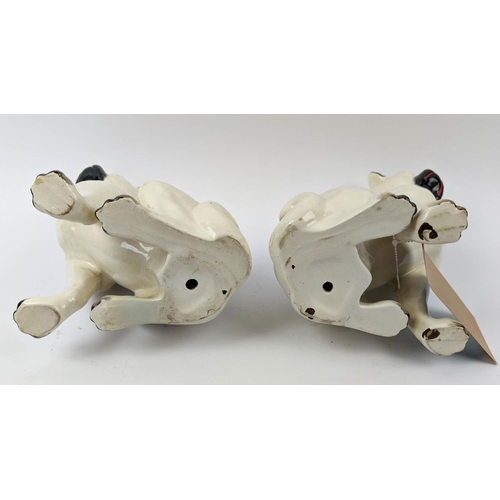 18 - STAFFORDSHIRE PUG DOGS, an opposing pair, late 19th century, 27cm H.