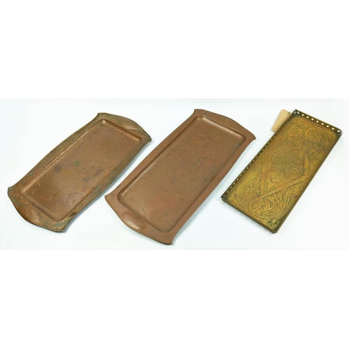 31 - NEWLYN SCHOOL BRASS ARTS AND CRAFTS TRAY, along with two shaped copper serving trays, 54cm x 20cm W.... 