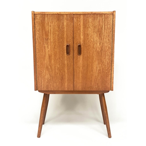 318 - CABINET, 1970s teak, with two doors enclosing a shelf on splayed supports, 61cm W x 36cm D x 100cm H... 