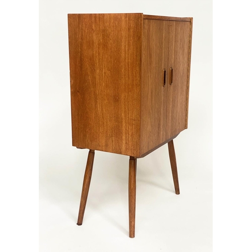 318 - CABINET, 1970s teak, with two doors enclosing a shelf on splayed supports, 61cm W x 36cm D x 100cm H... 