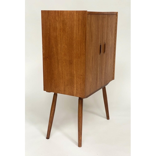 318 - CABINET, 1970s teak, with two doors enclosing a shelf on splayed supports, 61cm W x 36cm D x 100cm H... 