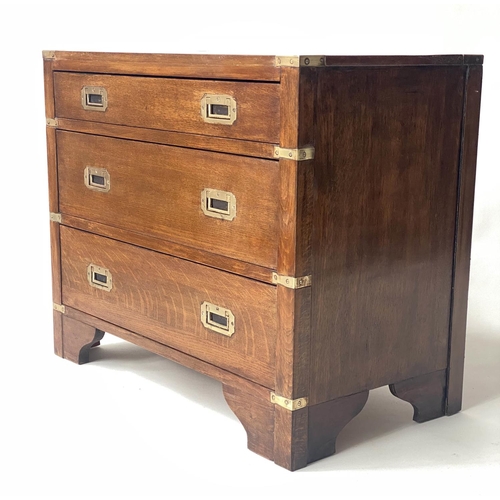 118 - CAMPAIGN STYLE CHEST, oak and brass bound with three long drawers, 75cm x 40cm x 60cm H.