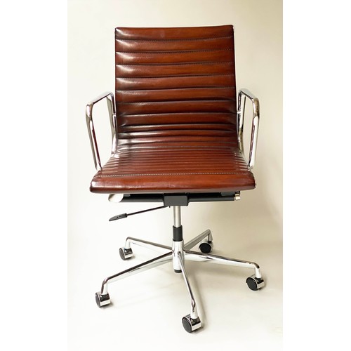 111 - REVOLVING DESK CHAIR, Charles and Ray Eames inspired ribbed, mid brown leather, revolving and reclin... 